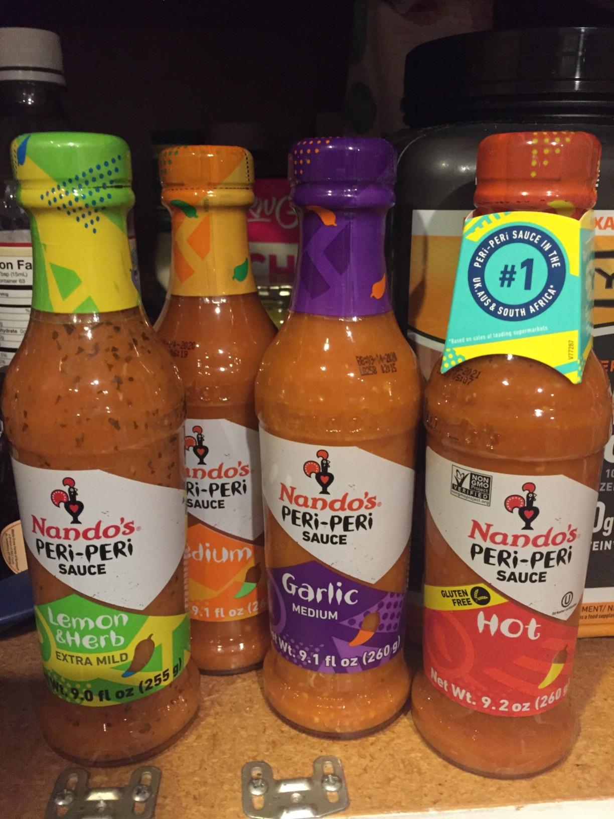 Nando's PERi-PERi Hot Sauce Variety Gift Pack - Medium, Hot, Garlic, Lemon & Herb Piri Piri Sauces | Flavorful Hot Sauce Gift Set Box | Great as Wing Sauces! Gluten Free - 9.1 oz (4 Pack) customer photo 1