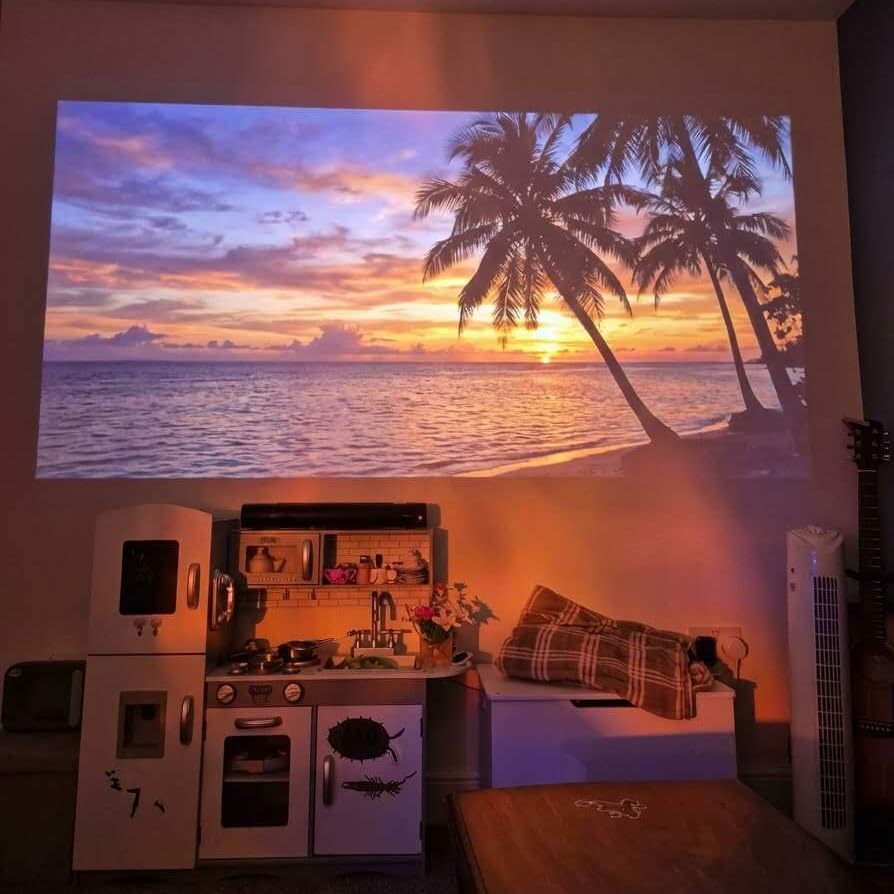 Smart Projector [Bundled with Google TV Stick & 4K Support] with WiFi and Bluetooth, Portable Mini Movie Short Throw Projector Outdoor with Built-in Apps Auto Focus for Home Theater Bedroom Ceiling customer photo 2