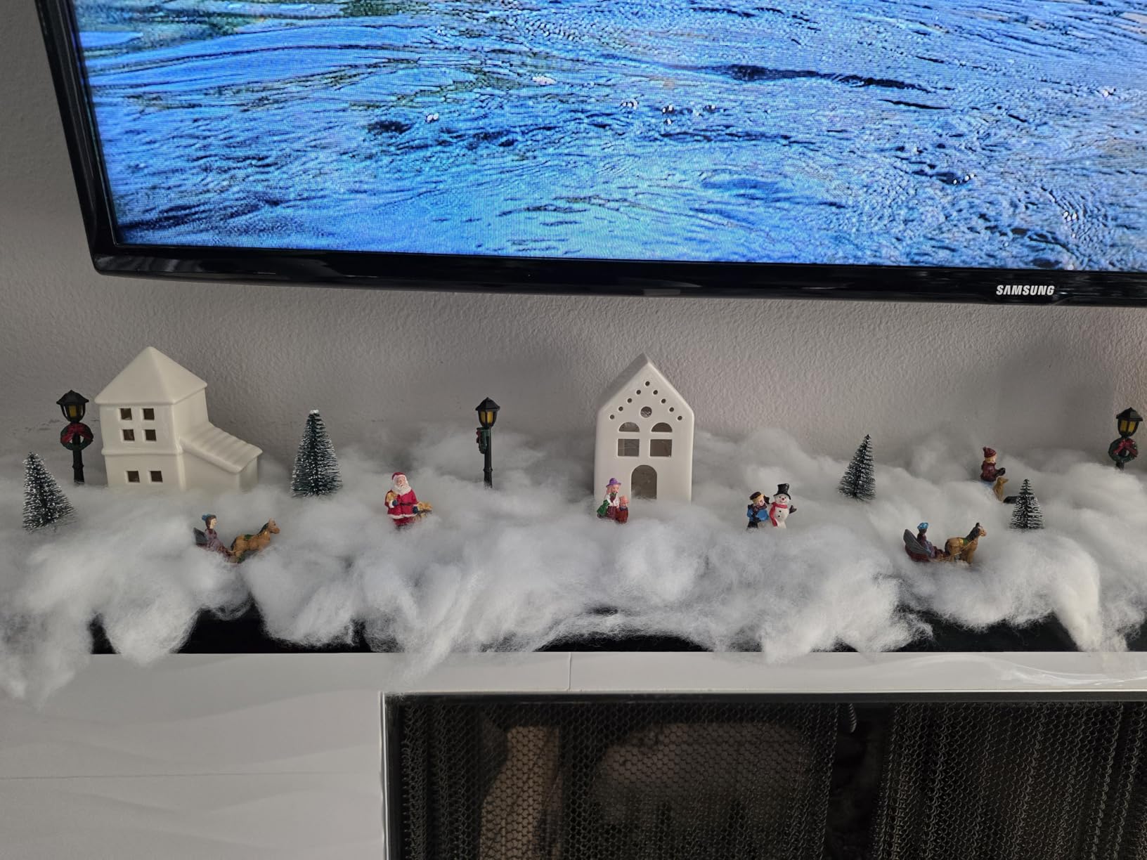 Soaoo 25 Pieces Christmas Village Sets Xmas LED Lighted Christmas Village Houses Mini Xmas Figurines Miniature for Collection Tabletop Mantel Shelf Indoor Accessories customer photo 1