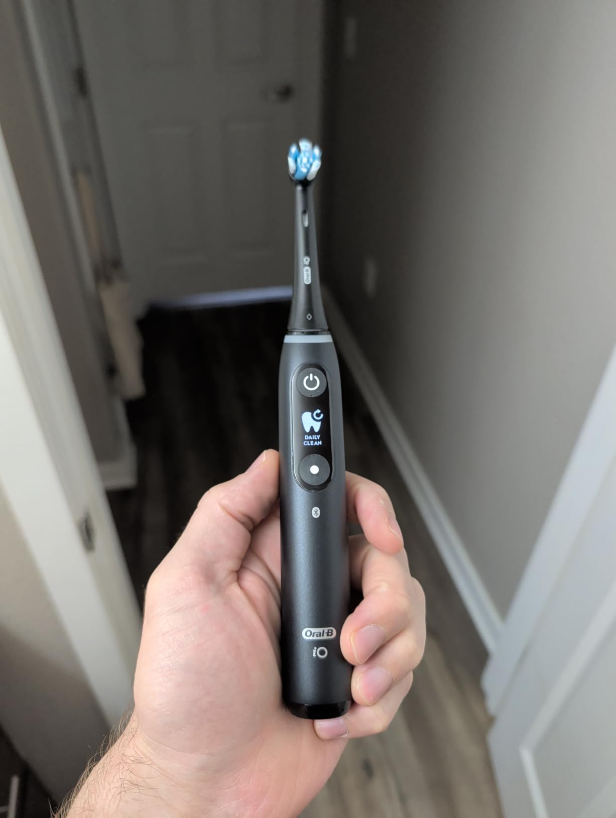 Oral-B iO Deep Clean + Protect Rechargeable Electric Toothbrush, Black, iO Series 7, 2 Replacement Brush Heads, Charging Travel Case (package may vary) customer photo 1